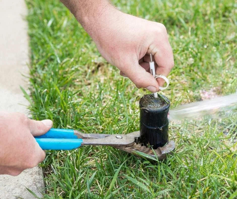 Turning on a sprinkler system with an irrigation key in Longview, Texas. Reliable irrigation service and system activation for homeowners across East Texas.
