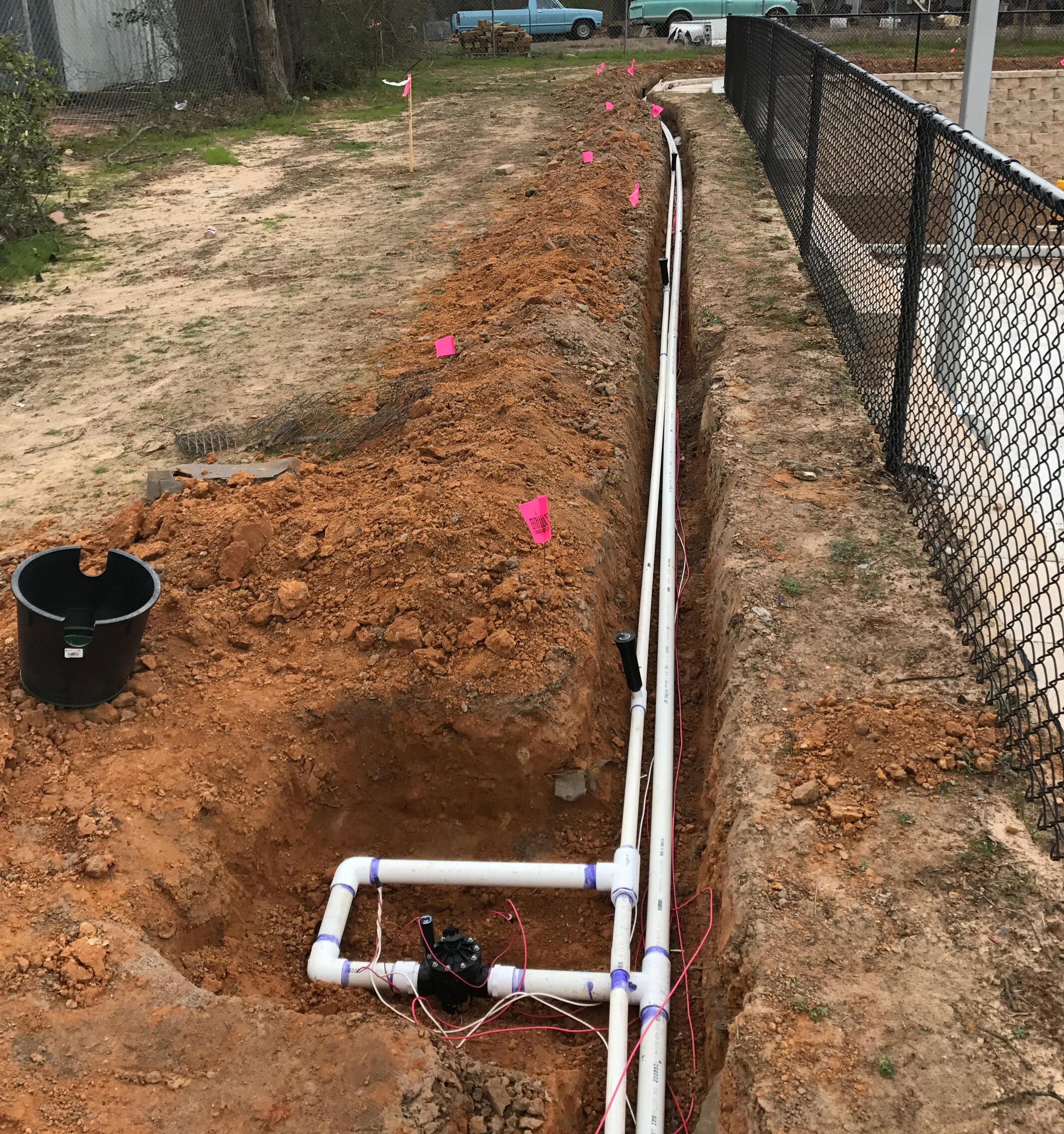 Hans de Jong Irrigation Company PVC irrigation piping installed in trench in Tyler, Texas. Durable underground sprinkler system setup for reliable East Texas irrigation performance.