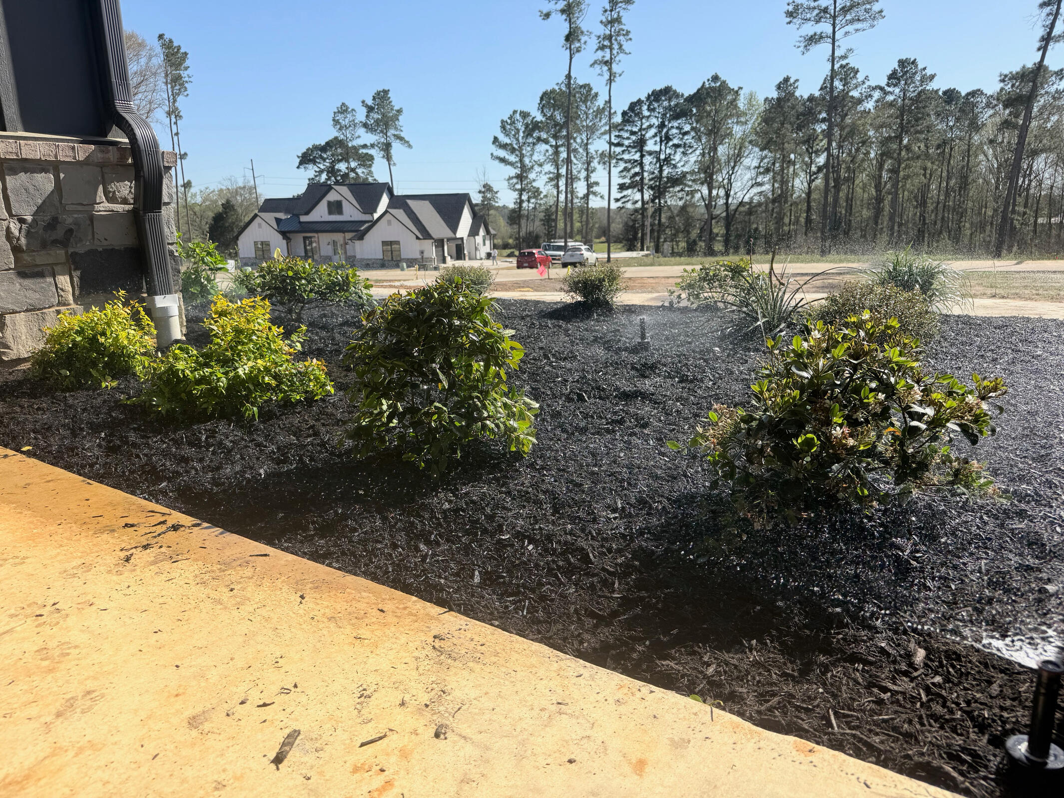 Hans de Jong Irrigation Company Above-ground water pump system installed near neighborhood utilities in Gladewater, Texas. Professional irrigation and pump solutions built for East Texas properties.